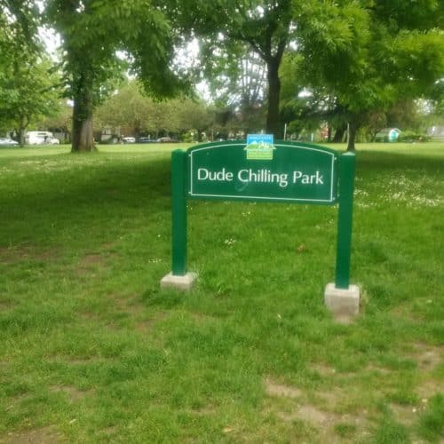 A picture of the park sign of dude chilling park in vancouver, bc
