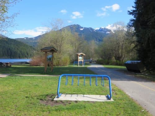 A bike rack next to the whistler valley trail, which runs through the park