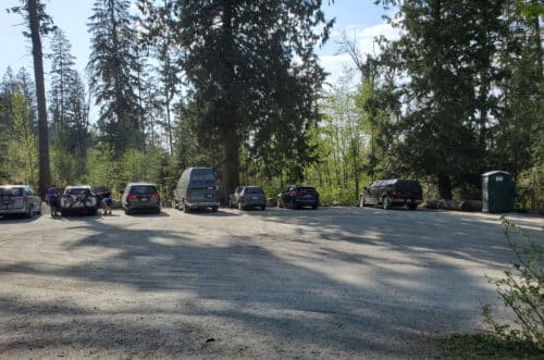 A picture of the parking lot and portable toilet at chilliwack community forest (off-leash trails), chilliwack, bc