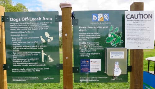 A picture of the off-leash sign at mcdonald beach off-leash dog park in richmond, bc