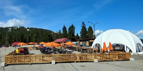 A picture of the dog-friendly outdoor patio and tent at the Rock Chute Kitchen and Bar Patio on Mount Seymour, North Vancouver, BC