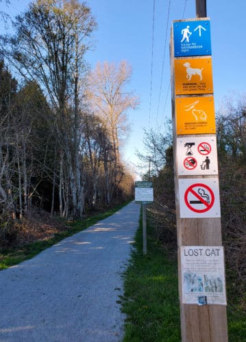 A picture of signage at the shell road off-leash trail in richmond, bc