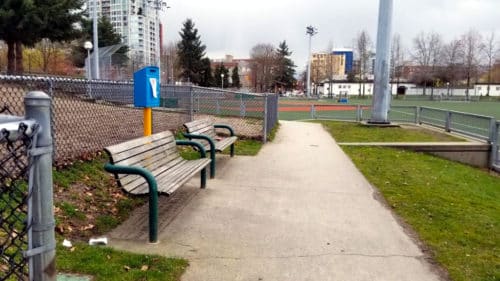 A view of the benches outside the dog off-leash area at andy livingston park in vancouver, bc