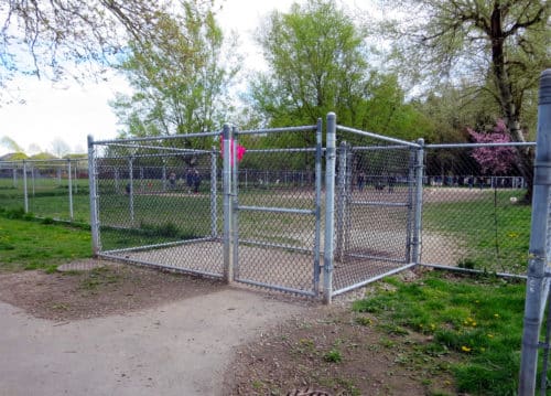 A picture of the double gated entry to the off-leash dog park in steveston community park